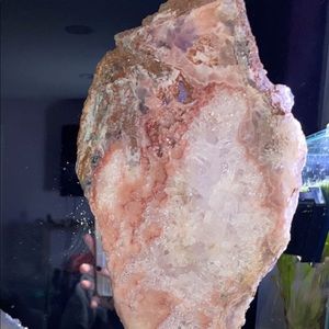 Crystal large pink amethyst mixed with clear quartz on stand.